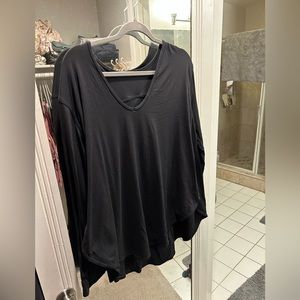 Long sleeve lulu lemon shirt. Very flattering shape and v neck like.